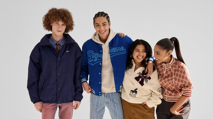 Four models wearing streetwear from Nike, Supreme, Kith and Gucci pose together against a white background, showcasing a mix of designer and contemporary fashion.