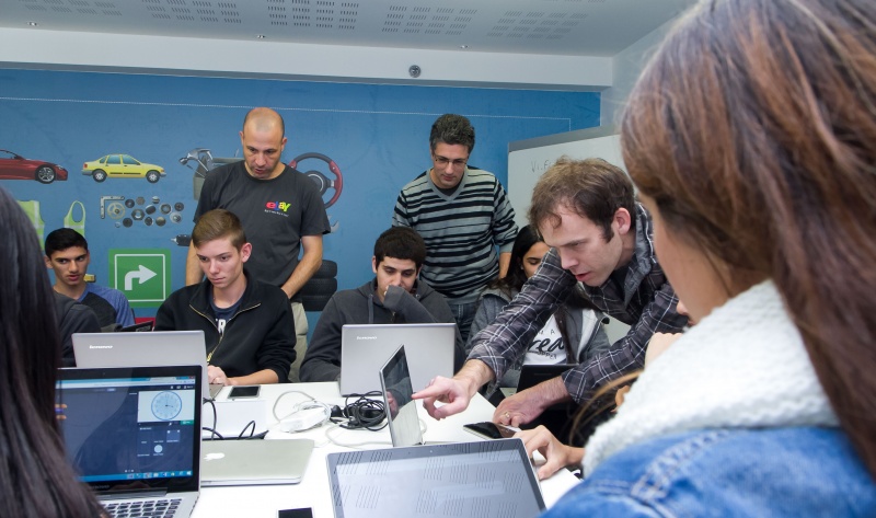 Students in Israel are led through the Hour of Code by eBay employees